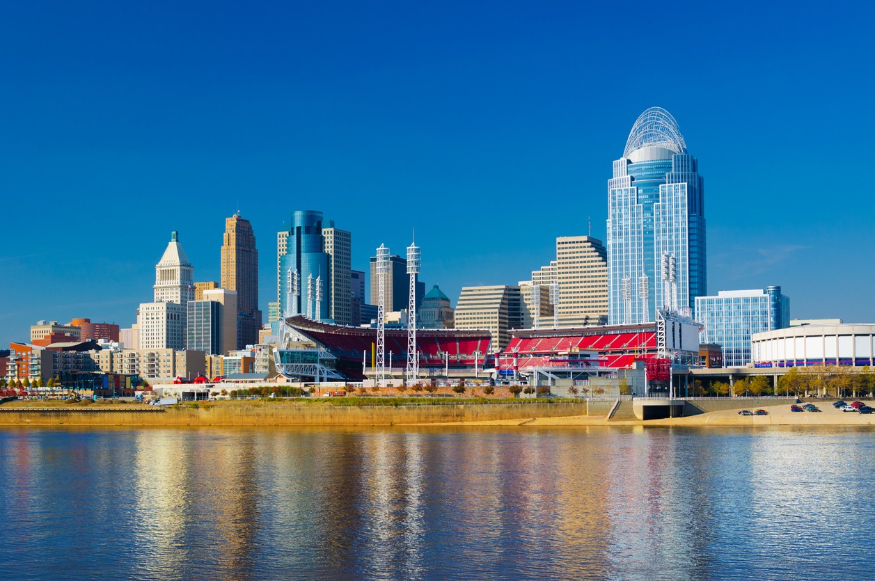 478945136 Downtown Cincinnati skyline in the background with the Great American Ball Park midway and the Ohio River in the foreground.